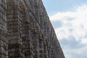 Tourism in Segovia, ancient Roman aqueduct in the Plaza del Azoguejo in Spain.
