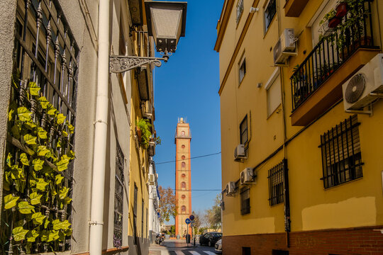 Charming street  with view at  historic Torre de los Perdigones in Seville, Andalusia, Spain