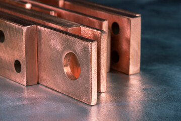 Copper flat bars, clean and polished, close-up view