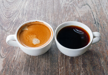 Two coffee cup, Americano coffee and espresso coffee on wooden table