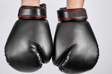 Man is fighting a brutal sport of boxing with his gloves. boxer glove fight concept. a man is fighting boxing with powerful gloves. a man is fighting a brutal sport of boxing with lifestyle gloves.