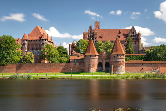 View of Malbork Castle (Zamek w Malborku) from other side of Nogat river. Long exposure shot