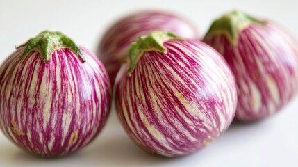 Obraz premium Vibrant Portrait of Fresh Eggplant on White Background - Healthy Vegetable Food Photography