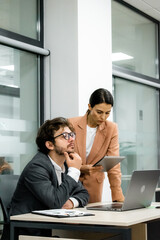 Professional management team in a meeting at the office. Leader discussing investment partnerships and digital project management with board members. Perfect shot to highlight effective teamwork and s