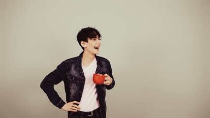 Early morning. A guy drinks hot coffee.