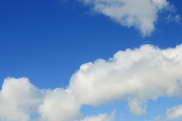 Naklejka premium Dreaming of a blue sky and clouds in nature. Cloudy weather bright concept. Blue sky with white clouds. Dreaming of a blue sky with white clouds lifestyle.