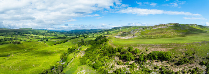 Panorama of Farms and Mountains over Bainbridge Villagefrom a drone, Leyburn, North Yorkshire, England © Maciej Olszewski