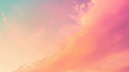 Obraz premium A vibrant sunset featuring vivid pink and yellow cloud formations against a calming blue sky, creating an exquisite interplay of colors and an atmosphere of warmth and peace.