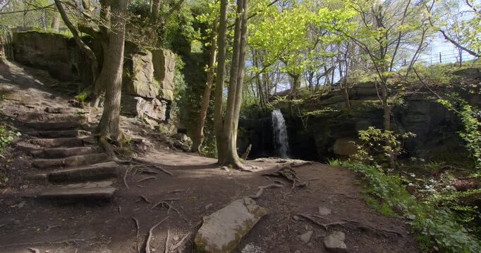 wide shot of Lumsdale waterfalls viewing platform with waterfall in background at Matlock