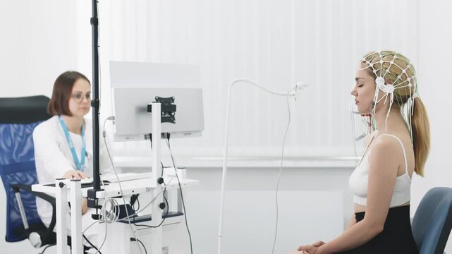 Female patient undergoing an EEG test, showcasing modern healthcare and patient comfort. Perfect for highlighting advanced diagnostic technology and patient-centered care.