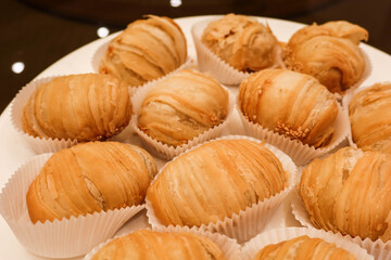 close up of Chinese fried Puff Pastries Filled with Shredded Turnip, baked deep fried turnip radish cake