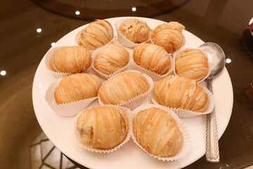 close up of Chinese fried Puff Pastries Filled with Shredded Turnip, baked deep fried turnip radish cake