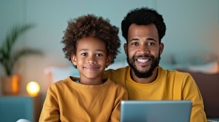 Loving father and his young son sharing a heartwarming moment as they watch a documentary together on a tablet in the comfort of their home creating a special bond and time