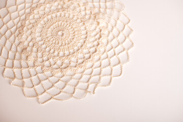 Handmade white crochet doily, ideal for table settings or as a decorative accent piece.