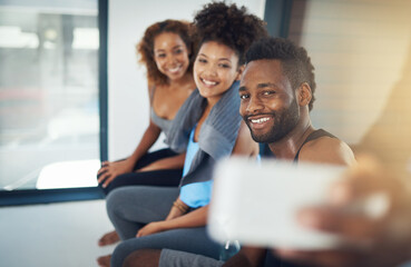 Man, selfie and friends in gym for fitness, support and motivation for exercise. Male trainer, group or happiness in wellness center for social media, progress update or smile in photography