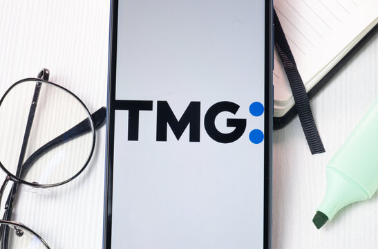 New York, USA - 1 August 2024: Troika Media Group TMG Logo on Phone Screen, Company Icon on Display