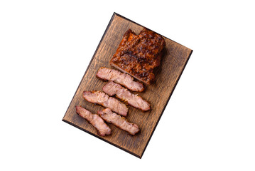 Fresh juicy delicious beef steak on a dark background