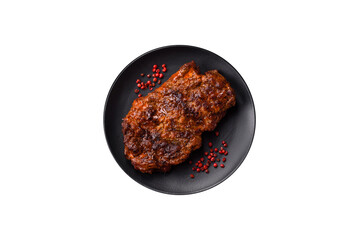 Fresh juicy delicious beef steak on a dark background