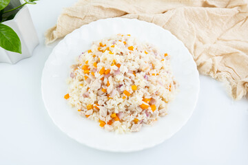 A plate of carrot and meat fried rice