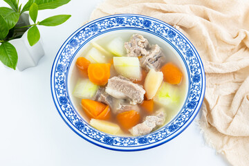 A bowl of carrot, winter melon and pork ribs soup
