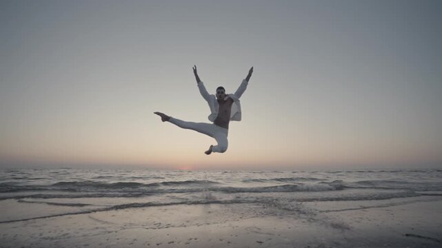 A dancer's leap into the sea