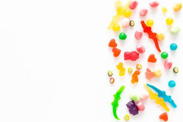 Flat lay of colorful candies and lollipop. Sweet food and candies background