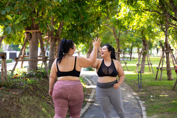 Fototapeta premium Bride Running outdoor woman. beautiful young chubby overweight woman in sportswear doing exercise outdoors at park. fitness sport club, body and health care. Activity