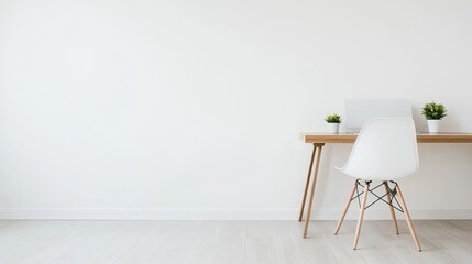 A well-organized home office features a wooden desk, computer, and potted plants that enhance the workspace ambiance for productivity and comfort