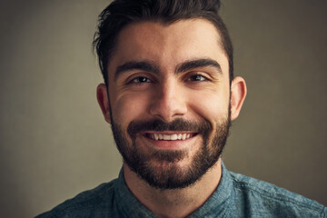 Fototapeta premium Beard, man and portrait in studio for hair care, date preparation and happiness. Male person, grooming or smile on background with confidence, natural facial or growth treatment with hipster style