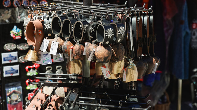 Souvenirs hanging for sale in Zermatt, Switzerland, showcasing local crafts and items for tourists