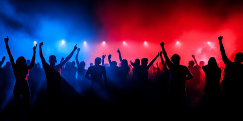 Obraz premium Silhouettes of a diverse crowd enjoying a concert, with raised hands and a vibrant atmosphere in the background