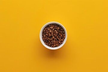 Top view of a coffee cup with beans on a yellow background. Mockup for design. 