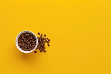 Top view of a coffee cup with beans on a yellow background. Mockup for design. 