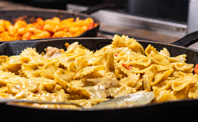 Delicious cooked Italian farfalle pasta butterfly or bow with cheese sauce. 