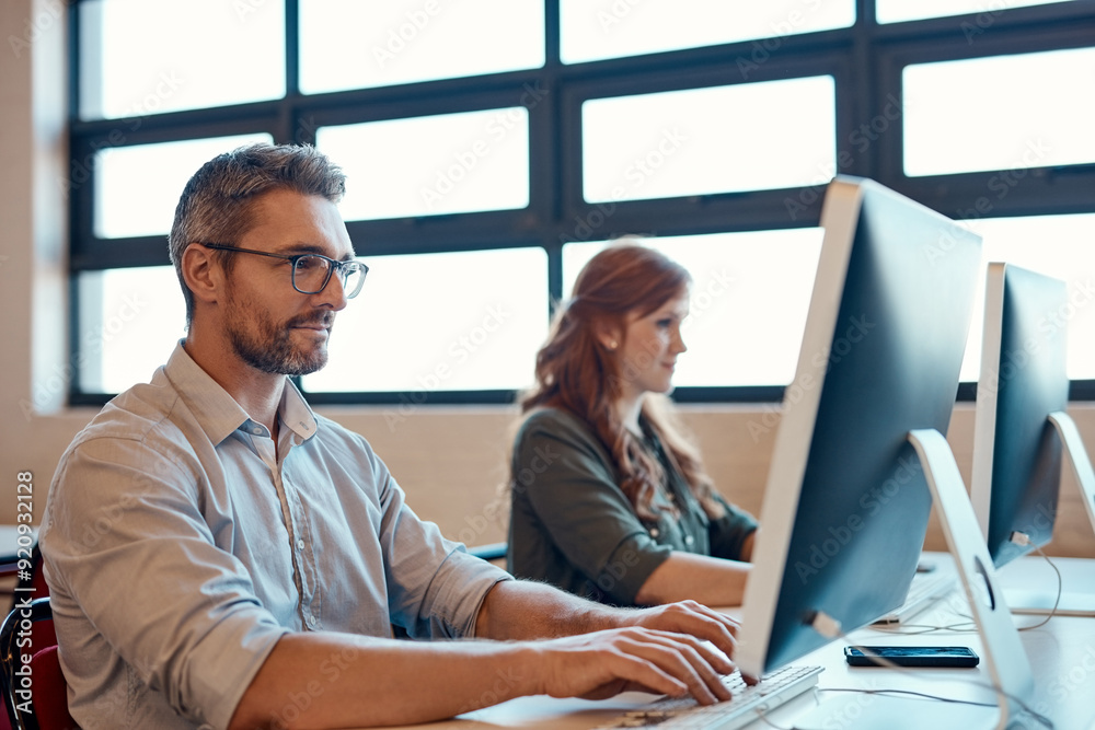 Poster thinking, mature man and coworking office with desk, working together and communication on computer.