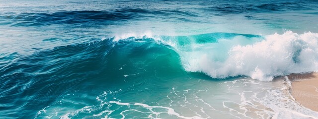 Fototapeta premium A wave crashes onto a sandy shore, its white crest touching a body of water Another wave forms atop it