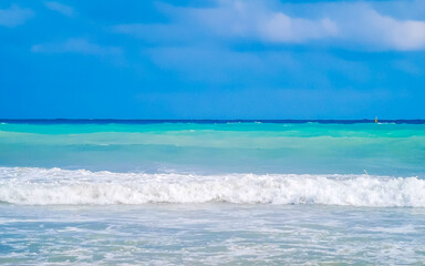 Tropical Caribbean beach clear water waves Playa del Carmen Mexico.