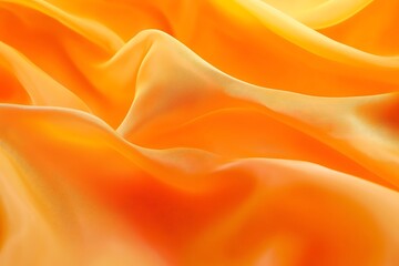 Obraz premium Abstract orange fabric background with soft folds and a delicate texture.
