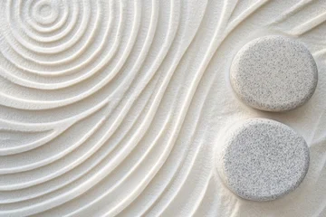 Serene patterns in white sand create a calming atmosphere, enhanced by two meticulously placed stones, embodying simplicity and tranquility