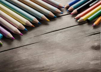 Colored pencils on a wooden table. Back to school concept. Stationery composition.