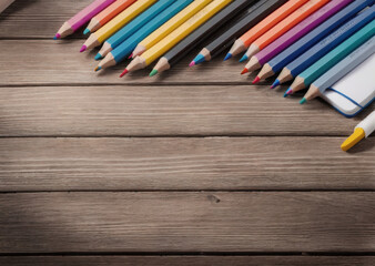 Colored pencils on a wooden table. Back to school concept. Stationery composition.