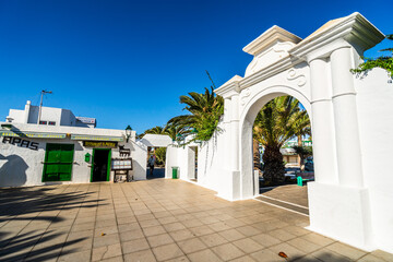 Picturesque whitewashed architecture with green elements in Costa Teguise, Lanzarote, Canary Islands