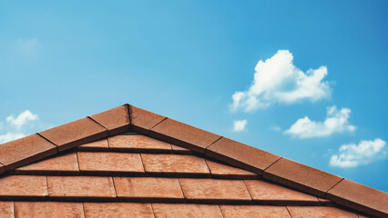 Home roof maintenance. Leakage at the top of orange concrete tile