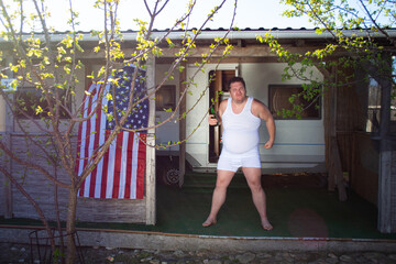 Early morning and a cold. A poor man lives in a trailer park.