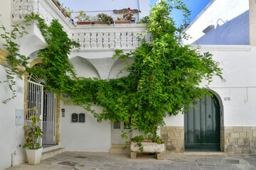 A narrow street in the historic center of Gallipoli, a tourist town in Puglia in Italy.