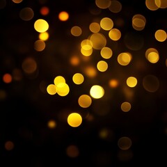 Obraz premium Blurred golden bokeh on black background