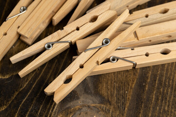 a group of wooden clothespins for drying clothes