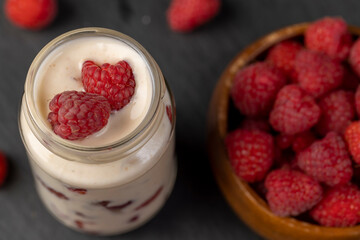 delicious and fresh yogurt with raspberry flavor and whole red raspberries