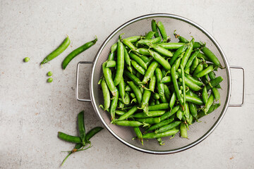 Fresh green peas in pods.