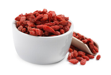 Dried goji berries in bowl and scoop isolated on white